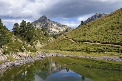 France, Hautes Pyrenees, Saint Lary Soulan and Vielle-Aure, hike on a variant of the GR10 between the Portet pass and the Bastan lakes on the edge of the Neouvielle nature reserve, the Pic de Bastan in the background