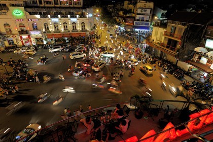 Vietnam, Hanoi, old town, traffic on the roundabout north of Hoan Kiem Lake also called Lake of the Restored Sword view from the Legends Beer