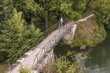 France, Deux-Sèvres, le Marais Poitevin, Green Venice, Coulon, cycling along the Sèvre Niortaise and crossing a footbridge (aerial view)