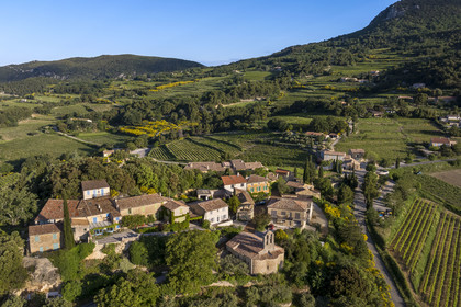 France, Vaucluse, Dentelles de Montmirail mountains, the village of Suzette surrounded by vineyards (aerial view)