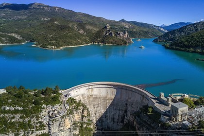 France, Alpes de Haute Provence, the lake of Castillon dam which retains the waters of the Verdon river, giant sundial on the 100 meters high wall (aerial view)