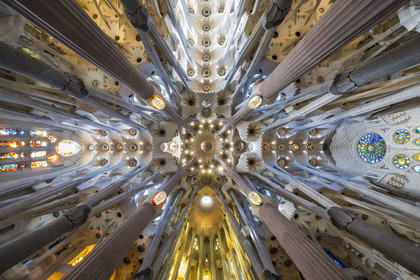 Spain, Catalonia, Barcelona, Eixample district, Sagrada Familia basilica by Catalan modernist architect Antoni Gaudi, listed as a UNESCO World Heritage Site, panoramic view from the vault at the nave and transept crossing which symbolizes the heavenly Jerusalem, the apse is at the bottom, the east on the right, the west on the left