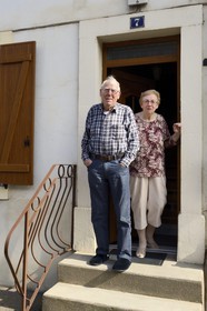 France, Moselle, Fensch Valley, workers' housing estate of Knutange, Raymond Pickard worker now retired from the factory and his wife outside their home