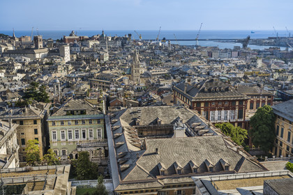 Italy, Liguria, Genoa, Rolli Palace listed as World Heritage by UNESCO in the Strada Nuova today via Garibaldi in the foreground, the Porto Antico (Old Port) and the commercial port in the background, seen from the Belvedere of Castelletto