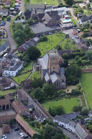 United Kingdom, England, Somerset, Dunster St George's church predominantly 15th century with evidence of 12th and 13th century work (aerial view)