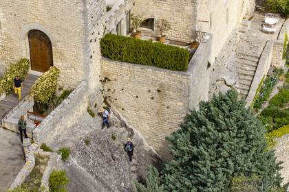 France, Vaucluse, Dentelles de Montmirail mountains, Crestet, the hilltop village of Crestet and its 9th century castle (aerial view)