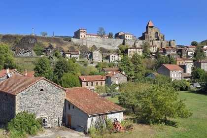 France, Haute Loire, high valley of the Allier, the priory of the 12th century Benedictine abbey overlooking the village of Chanteuges at the end of a volcanic flow mesa