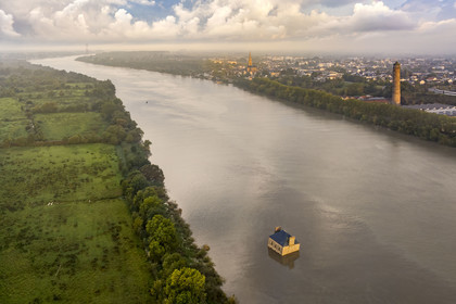France, Loire Atlantique, Coueron, open-air contemporary art collection Estuaire, La Maison dans la Loire (The House in the Loire river) created by the artist Jean-Luc Courcoult and the 69 m high Shot Tower built in the 19th century (aerial view)