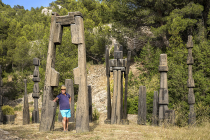 France, Bouches du Rhone, Marseille, Goudes district, La Friche de l'Escalette in the ruins of an old lead processing plant, the collector and creator of the place Eric Touchaleaume in front of the Summer in the Forest (1964-1966) by artist François Stahly