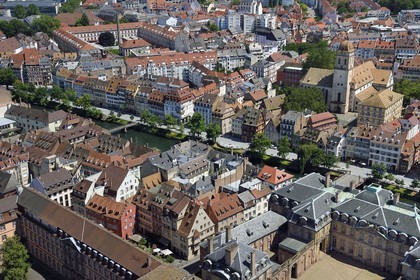 France, Bas Rhin, Strasbourg, old town listed as World Heritage by UNESCO, the Palais Rohan (Rohan Palace) right in the foreground, the quai des Bateliers transformed into pedestrian meeting area and the Sainte Madeleine church in the background