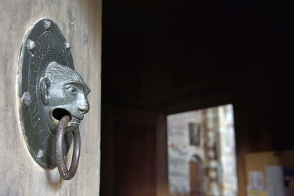 France, Haute Loire, Brioude, the Basilica of Saint-Julien de Brioude in Auvergne Romanesque style, south door 12th century bronze knocker which represents the facies of a mischievous monkey