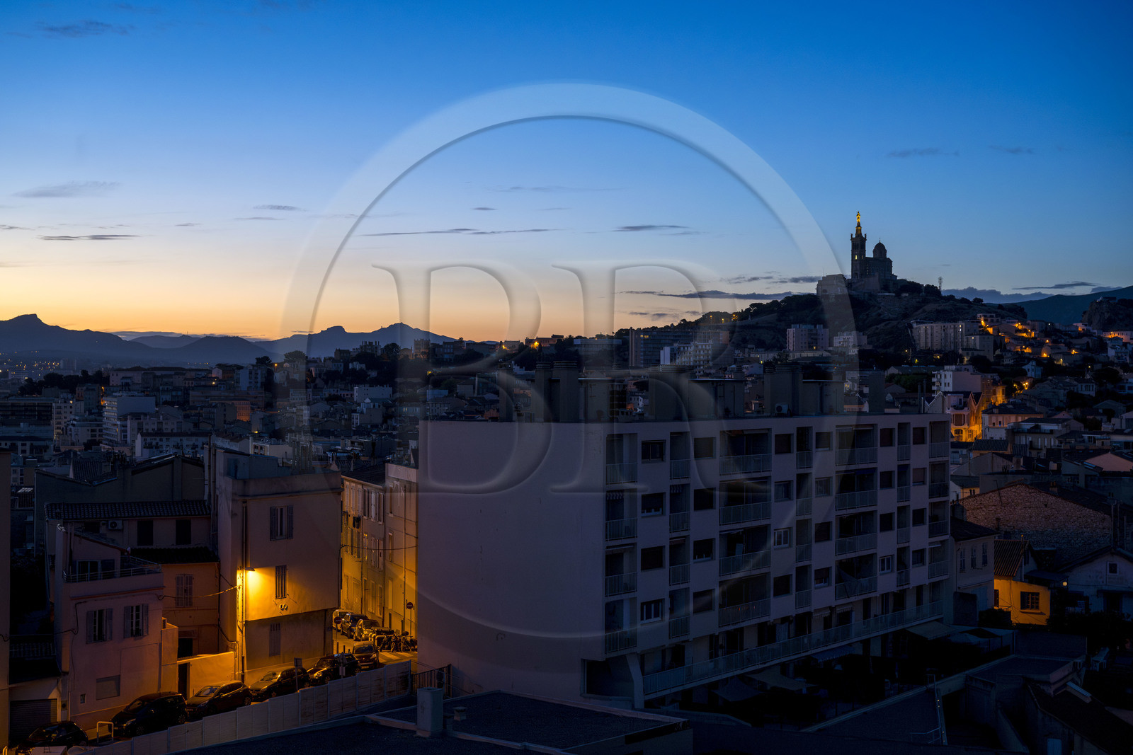 France, Bouches du Rhone, Marseille, building on rue Robert et Fenelon Guidicelli and Notre-Dame de la Garde in the background