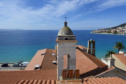 France, Corse du Sud, Ajaccio, St. Erasmus church devoted to the saint patron of the fishermen overlooking the bay of Ajaccio in the background
