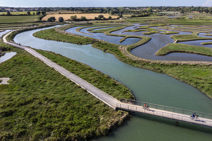 France, Vendée (85), Talmont Saint Hilaire, Guittière marshes in the hinterland of Pointe du Payré, footbridge over the Payré river (aerial view)