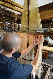 France, Rhone, Lyon, La Croix Rousse District, Silk manufacturer Prelle, silk loom developed by Joseph Marie Jacquard called Jacquard loom, the canut (lyonnais silk worker) Sebastien preparing his loom