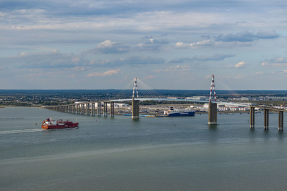 France, Loire Atlantique, the Saint-Nazaire bridge and the port of Saint-Nazaire in the background (aerial view)