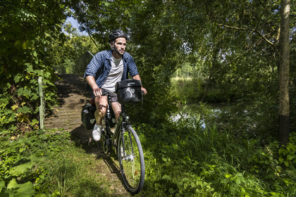 France, Deux-Sèvres, le Marais Poitevin, Green Venice, Le Vanneau-Irleau, bicycle journey along the canals and crossing a footbridge