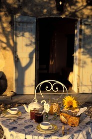 France, Gard, a table for breakfast in the Provencal bed and breakfast Le Mas de l' Amandier