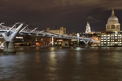 United Kingdom, London, the City, the Millennium Bridge by architect Norman Foster on the Thames river and St. Paul's Cathedral in the background