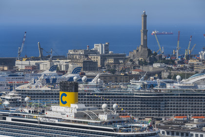 Italy, Liguria, Genoa, the commercial port and the passenger terminal dominated by the Lanterna lighthouse