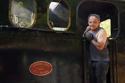 France, Alpes-Maritimes, Puget Theniers, steam engine warming up, Luc Cabouret volunteer of G.E.C.P. that restores and operates the Train des Pignes historic train