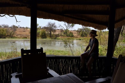 Zimbabwe, Midlands Province, Gweru, Antelope Park, terrace of a bungalow overlooking the water point