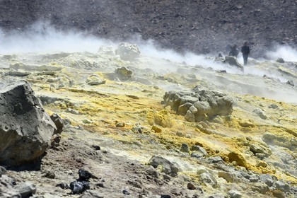 Italy, Sicily, Aeolian Islands, listed as World Heritage by UNESCO, Vulcano Island, hikers climbing the crater of volcano della Fossa through sulfur fumaroles