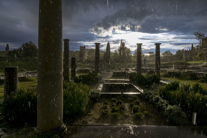 France, Vaucluse, Dentelles de Montmirail mountains,  Vaison la Romaine, Villasse archaeological site, remains of the House of the Dolphin whose impluvium can be seen under a rain shower