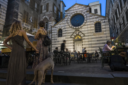 Italy, Liguria, Genoa, alley of the old historic center, restaurant terrace in Piazza San Matteo