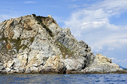 France, Var, Six Fours les Plages, Ile des Embiez, Pointe du Coucoussa overlooked by the Tour de la Marine, Freestyle windsurfing champion Adrien Bosson on a paddle boarding excursion