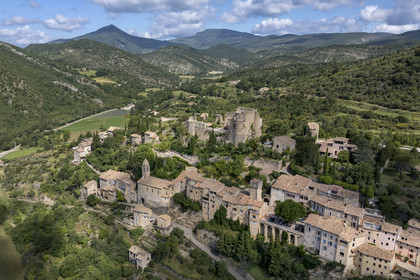 France, Drome, regional natural park of Baronnies provencales, Montbrun les Bains, labeled the Most Beautiful Villages of France, the village and the Renaissance castle of Dupuy-Montbrun (aerial view)