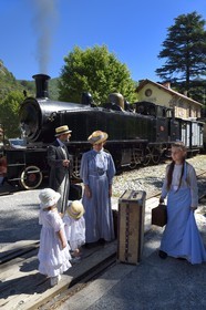 France, Alpes-Maritimes, Puget Theniers, the Train des Pignes historic train, members of the AHVAE (Association d'histoire vivante et de d'archeologie expérimentale) in Belle Epoque costume in front of the steam engine