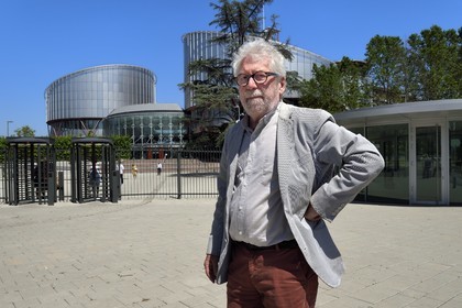 France, Bas Rhin, Strasbourg, European district, the architect Claude Bucher in front of the building of the European Court of Human Rights that he designed with the architect Richard Rogers