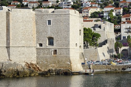 Croatia, Dalmatia, Dalmatian coast, Dubrovnik, Historic Centre listed as World Heritage by UNESCO, the ramparts on the sea side and the Saint Jean Tower building at the entrance to the Port