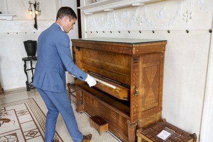 France, Alpes-Maritimes, Beaulieu-sur-Mer, neo-Greek style villa Kerylos build in 1908 by architect Emmanuel Pontremoli, the Oikos or room dedicated to the arts, the only folding camouflaged piano made by Pleyel