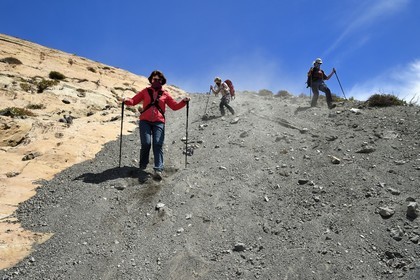 Italy, Sicily, Aeolian Islands, listed as World Heritage by UNESCO, Vulcano Island, hikers descending the crater flanks of volcano della Fossa