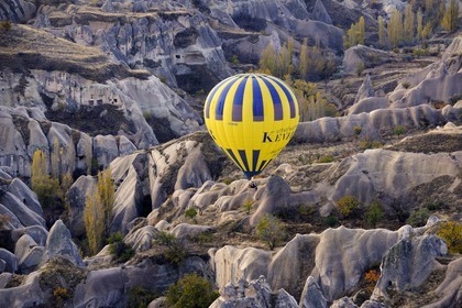 Turkey, Central Anatolia, Nevsehir Province, Cappadocia listed as World Heritage by UNESCO, hot air baloon flying over Balkan Valley in Ortahisar (aerial view)