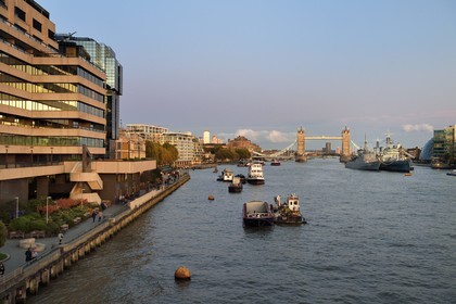United Kingdom, London, the City, the Thames riverbanks, the warship HMS Belfast and the Tower Bridge swinging bridge in the background