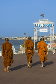 France, Alpes-Maritimes, Nice, listed as World Heritage by UNESCO, Tibetan monks on the quay of the United States walking in front of the Beau Rivage