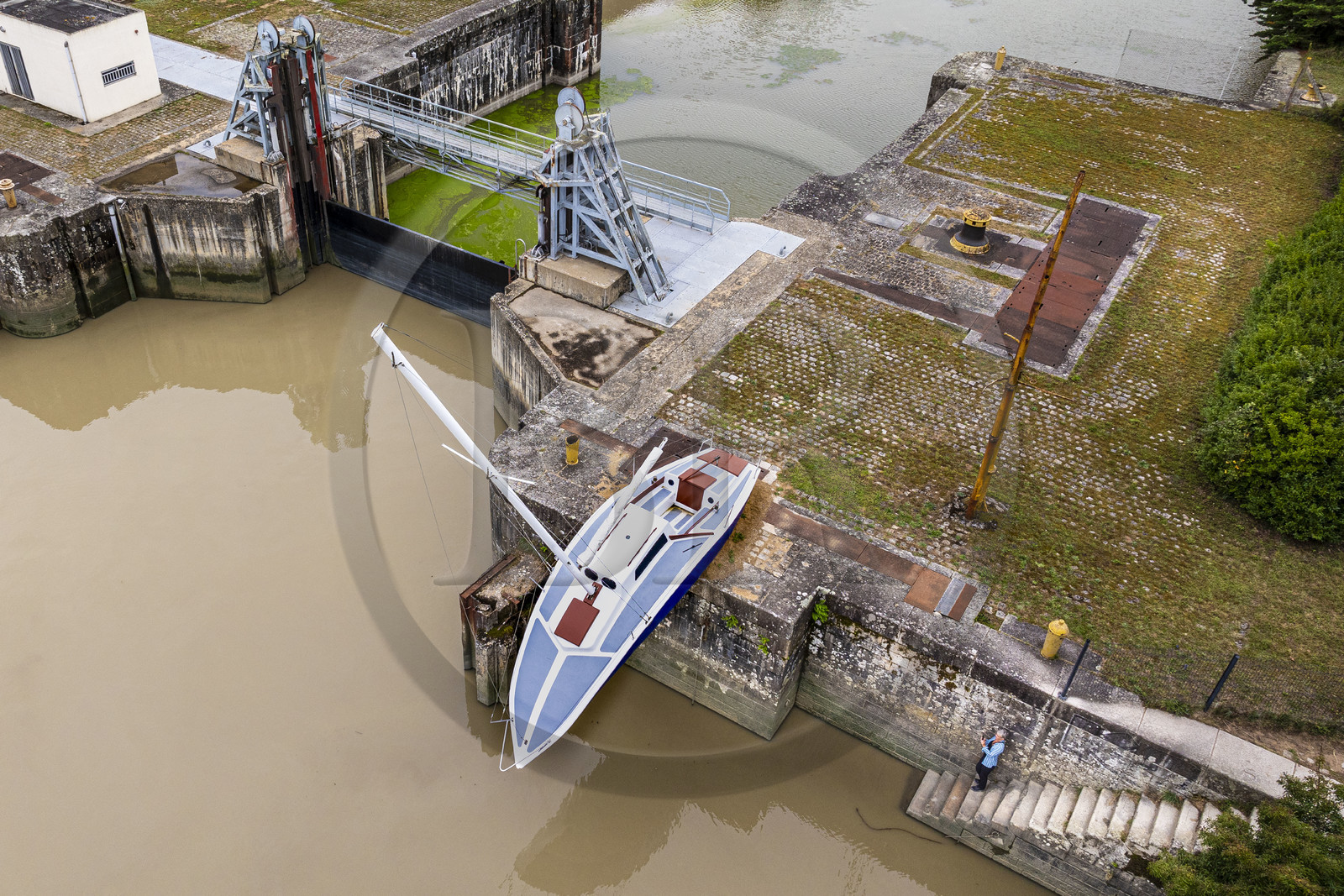 France, Loire Atlantique, Le Pellerin, open-air contemporary art collection Estuary, the 9 m long sailboat sculpture Misconceivable created by the Austrian artist Erwin Wurm at the access lock to the Martinière canal on the Loire river (aerial view)