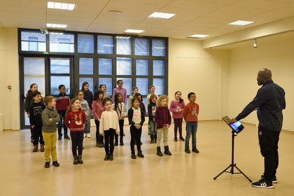 France, Bas Rhin, Strasbourg, old town listed as World Heritage by UNESCO, rehearsal of the Gospel Kids choir under the direction of choir master Alfonso Nsangu