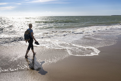France, Vendée (85), Talmont Saint Hilaire, la Pointe du Payré, hiker on Veillon beach