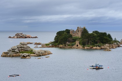 France, Cotes-d'Armor, Cote de Granit Rose (the Pink Granite coast), Tregastel, Costaeres castle and island, fishing boat