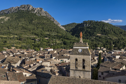 France, Drome, regional natural park of Baronnies provencales, Buis les Baronnies overlooked by the large limestone blade of the Rocher de Saint-Julien, the church of Our Lady of Nazareth (13th century) in the foreground (aerial view)