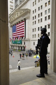 United States, New York, Manhattan, heavy armed police officer in front of the Wall Street Stock Exchange