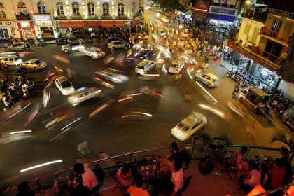 Vietnam, Hanoi, old town, traffic on the roundabout north of Hoan Kiem Lake also called Lake of the Restored Sword view from the Legends Beer