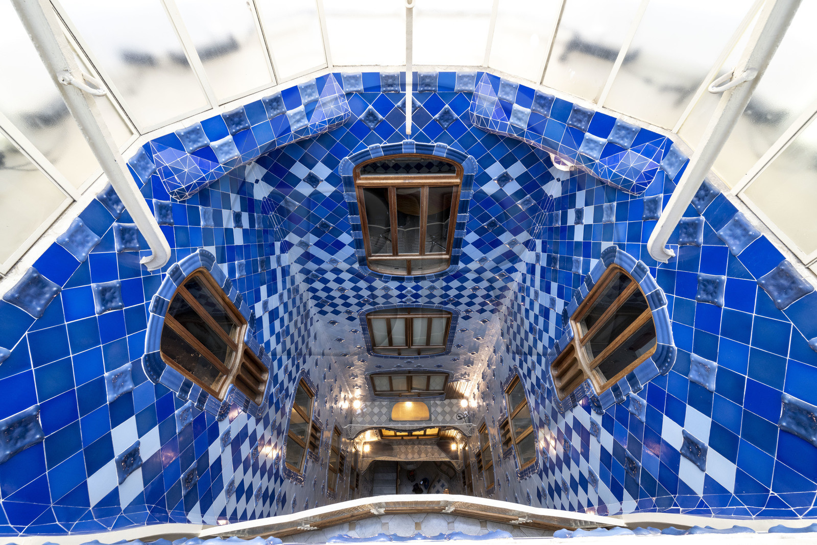 Spain, Catalonia, Barcelona, Eixample district, Passeig de Gracia, Casa Batllo by Catalan modernist architect Antoni Gaudi, UNESCO World Heritage site, courtyard, color gradient in the skylight