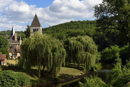 France, Dordogne, Perigord Noir, Vezere Valley, Saint Leon sur Vezere, labelled Les Plus Beaux Villages de France (The Most Beautiful Villages of France), the village on the banks of the Vezere river and the Clerans castle in the background left