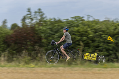 France, Maine-et-Loire, Loire valley listed as World Heritage by UNESCO, Saumur towards Saint-Hilaire, bicycle journey with a trailer carrying camping equipment