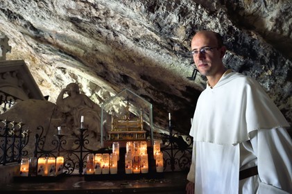 France, Var, Plan d'Aups Sainte Baume, Sainte-Baume Regional Nature Park, Sainte Baume massif, the cave sanctuary of Sainte Marie-Madeleine (St. Mary Magdalene), Brother Patrick-Marie Bozo, the prior of the Dominican community of Sainte-Baume, in front of the reliquary containing presumed relics (tibia and lock of hair) of Mary Magdalene